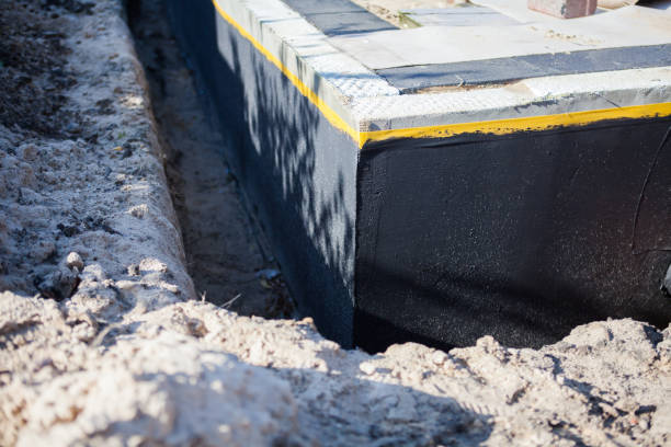 Professional Waterproofing technician working in Genesee, MI